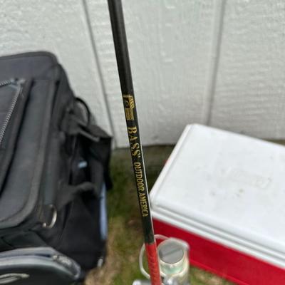 FISHING POLES WITH REELS, SOFT SIDED TITAN COOLER AND AN AUTO TRASH BIN