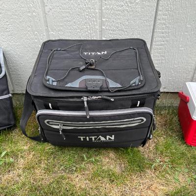 FISHING POLES WITH REELS, SOFT SIDED TITAN COOLER AND AN AUTO TRASH BIN