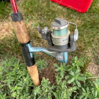 FISHING POLES WITH REELS, SOFT SIDED TITAN COOLER AND AN AUTO TRASH BIN