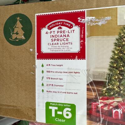 4 FT PRE-LIT TREE, ORNAMENTS, FAUX POINSETTIAS, ROPE LIGHT AND FREE STANDING SNOWMAN