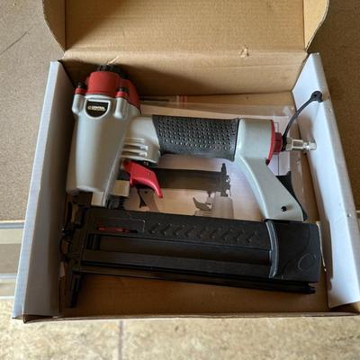 BULLS EYE STUD FINDER, AIR NAILER/STAPLER AND A CORDED POWER DRILL