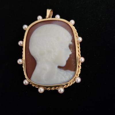 Sale Photo Thumbnail #110: Cameos are rarely found with a young boy.  Seed pearls are embedded 
in the 10K gold setting, Victorian era.  Retails at $200 to $400
