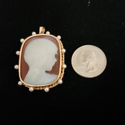 Sale Photo Thumbnail #109: Cameos are rarely found with a young boy.  Seed pearls are embedded 
in the 10K gold setting, Victorian era.  Retails at $200 to $400