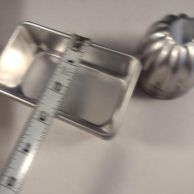 Collection of Metal Molds with Covered Refrigerator Container