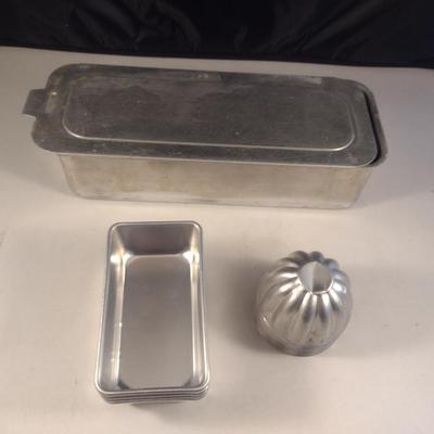 Collection of Metal Molds with Covered Refrigerator Container