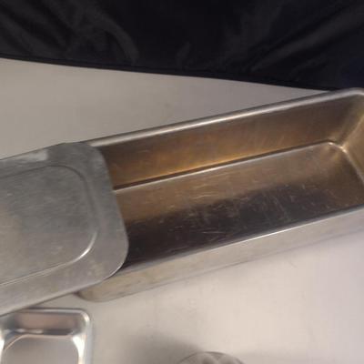 Collection of Metal Molds with Covered Refrigerator Container