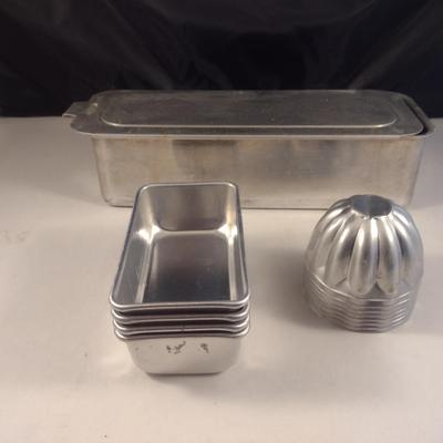 Collection of Metal Molds with Covered Refrigerator Container