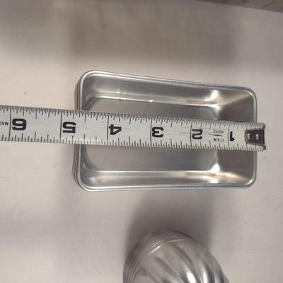 Collection of Metal Molds with Covered Refrigerator Container