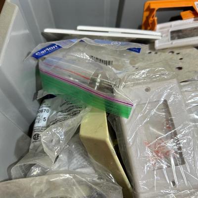 2 STACKING BINS OF ELECTRICAL AND PLUMBING HARDWARE