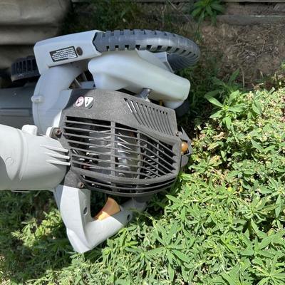 RYOBI GAS BLOWER/VACUUM AND RYOBI CORDLESS WEED CUTTER WITH CHARGER AND 2 BATTERIES