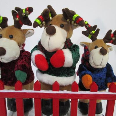 3 electric musical moving reindeer on base