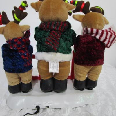 3 electric musical moving reindeer on base