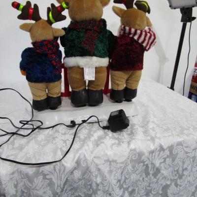 3 electric musical moving reindeer on base
