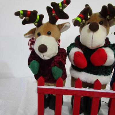 3 electric musical moving reindeer on base