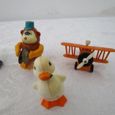 Vintage mini toys, 7 wind up, 2 are transformers