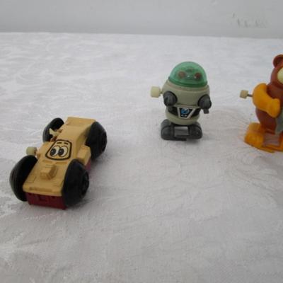 Vintage mini toys, 7 wind up, 2 are transformers