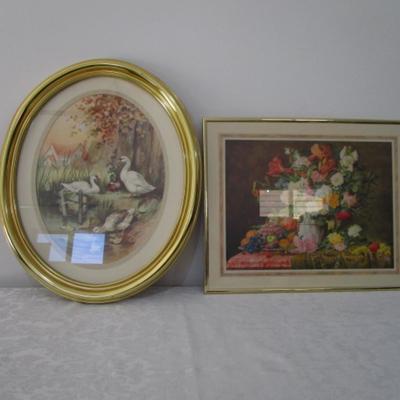 1 oval framed picture of geese near water, 1 framed floral picture
