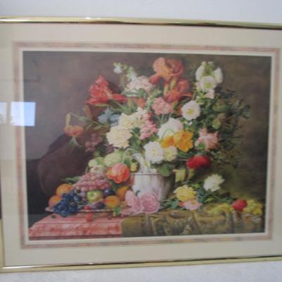 1 oval framed picture of geese near water, 1 framed floral picture