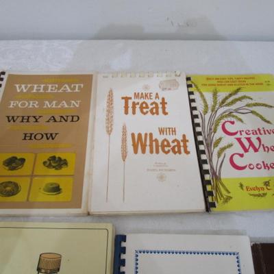 3 cooking with wheat books, 1 dehydrating book, 2 cookbooks