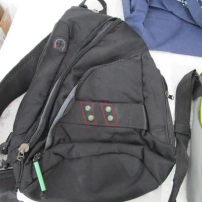 1 messenger bag, 1 over shoulder backpack/purse, 2 shopping bags