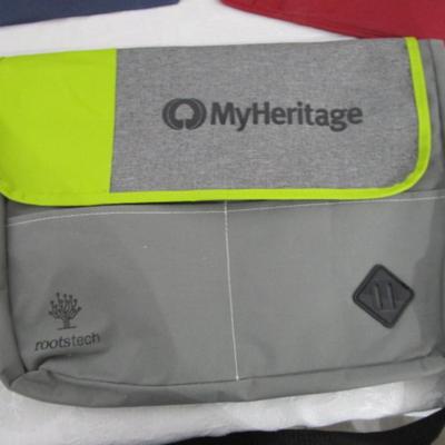 1 messenger bag, 1 over shoulder backpack/purse, 2 shopping bags