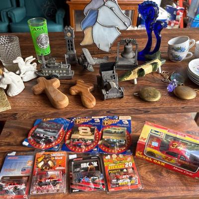 Cars, miniature pencil sharpeners, crosses, and more