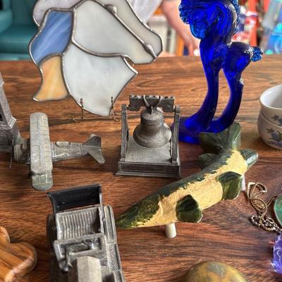 Cars, miniature pencil sharpeners, crosses, and more