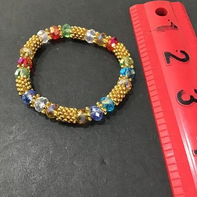 Sale Photo Thumbnail #30: Multi colored glass beaded fashion stretchy bracelet. Please see attached photos.