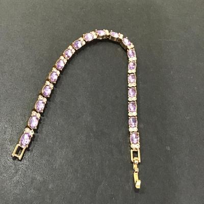 Sale Photo Thumbnail #102: Very nice gold tone purple glass, rhinestone tennis bracelet. Please see attached photos.