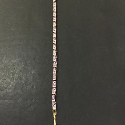 Sale Photo Thumbnail #100: Very nice gold tone purple glass, rhinestone tennis bracelet. Please see attached photos.