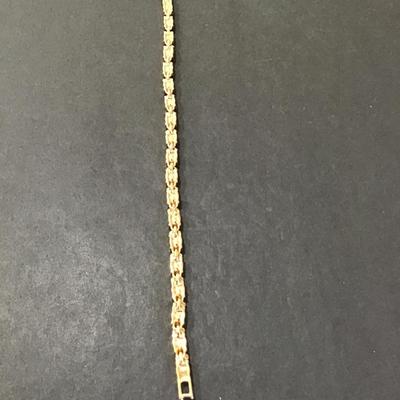 Sale Photo Thumbnail #103: Very nice gold tone purple glass, rhinestone tennis bracelet. Please see attached photos.