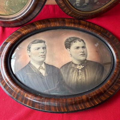 Three vintage oval bubble glass pictures