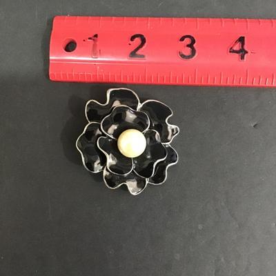 Sale Photo Thumbnail #116: Silvertone black enamel brooch. Please see attached photos.