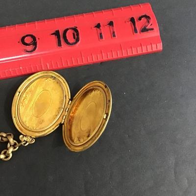 Sale Photo Thumbnail #148: Vintage gold tone chain and locket . 
Please attach photos.