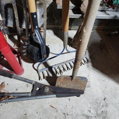 Lot of Garden Tools , Car Jacks , Garden Sprayers, Axe, Racks, Pick, Pitch Fork