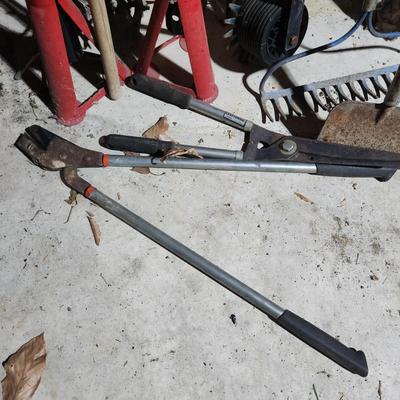 Lot of Garden Tools , Car Jacks , Garden Sprayers, Axe, Racks, Pick, Pitch Fork
