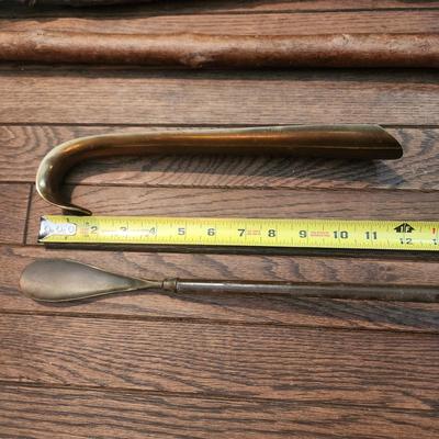 2 Walking Sticks Canes 2 Shoe Horns 1 Very heavy Brass 1 w a Sword handle