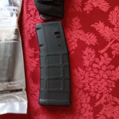 4 MAGPUL PMAG 30 AR/M4, HOLSTER AND A FOAM SKULL IN ROUGH SHAPE
