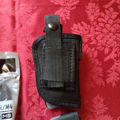 4 MAGPUL PMAG 30 AR/M4, HOLSTER AND A FOAM SKULL IN ROUGH SHAPE