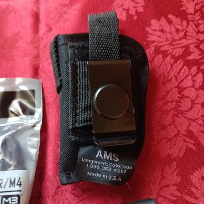 4 MAGPUL PMAG 30 AR/M4, HOLSTER AND A FOAM SKULL IN ROUGH SHAPE