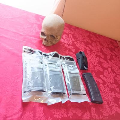4 MAGPUL PMAG 30 AR/M4, HOLSTER AND A FOAM SKULL IN ROUGH SHAPE
