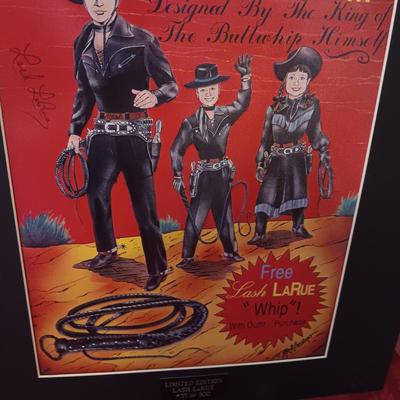 TIN AUTOGRAPHED LASH LARUE SIGN AND A FRAMED VINTAGE ADVERTISEMENT