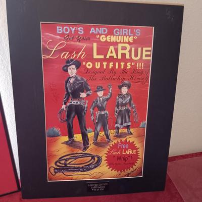 TIN AUTOGRAPHED LASH LARUE SIGN AND A FRAMED VINTAGE ADVERTISEMENT