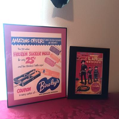 TIN AUTOGRAPHED LASH LARUE SIGN AND A FRAMED VINTAGE ADVERTISEMENT