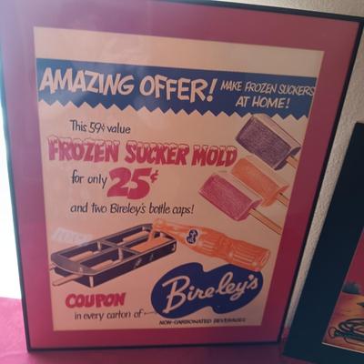 TIN AUTOGRAPHED LASH LARUE SIGN AND A FRAMED VINTAGE ADVERTISEMENT