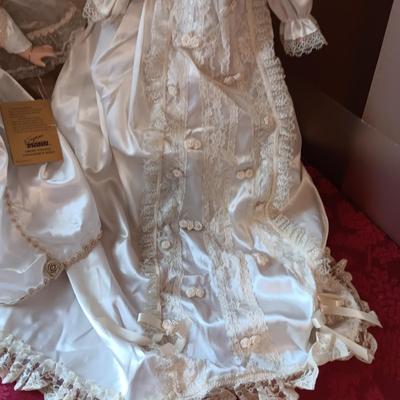 2 PORCELAIN DOLLS IN WEDDING DRESSES