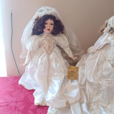 2 PORCELAIN DOLLS IN WEDDING DRESSES
