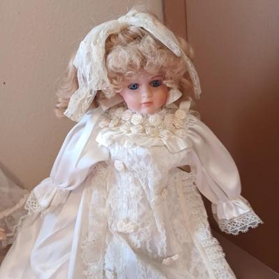 2 PORCELAIN DOLLS IN WEDDING DRESSES