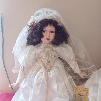 2 PORCELAIN DOLLS IN WEDDING DRESSES
