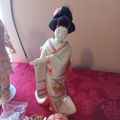MANY STARS NATIVE AMERICAN THEMED DOLL AND A GEISHA PORCELAIN DOLL